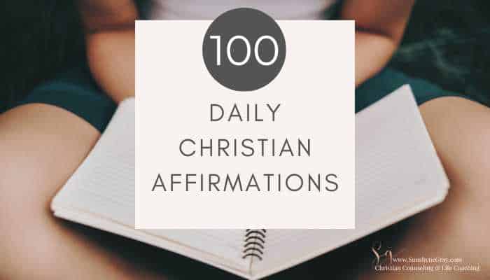 person holding a journal; title- 100 daily christian affirmations